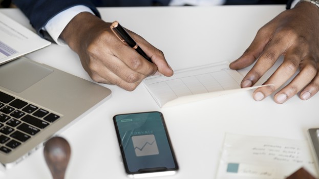 Businessman checking bankbook