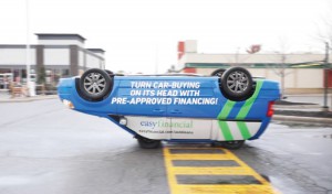 For easyfinancial, A+D welded a Dodge van to a cut-down Smart car and placed the apparently overturned vehicle at various locations to highlight the lender’s new auto-loan offering.